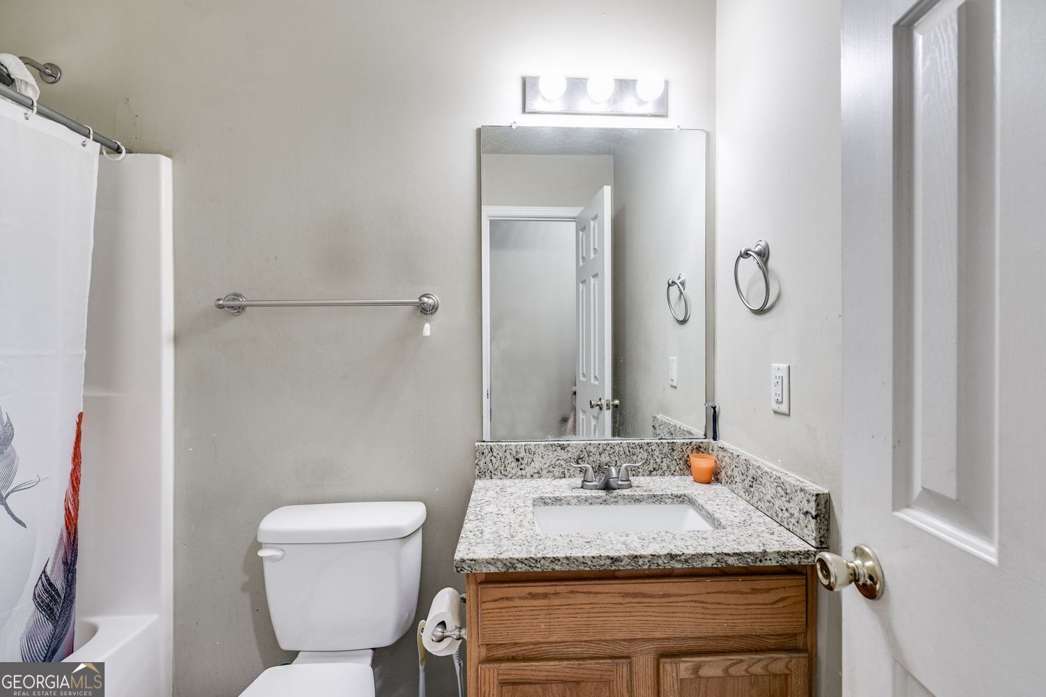 674 Fairview Drive Dallas, GA 30157 - Photo 18 of 24 a bathroom with a granite countertop sink toilet and mirror
