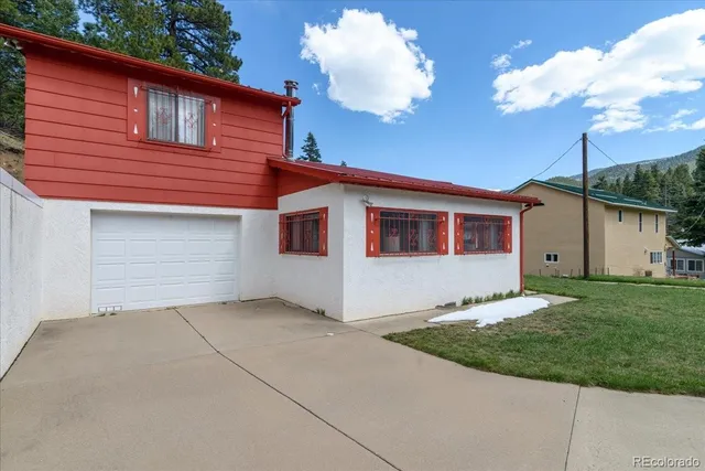 a front view of a house with yard