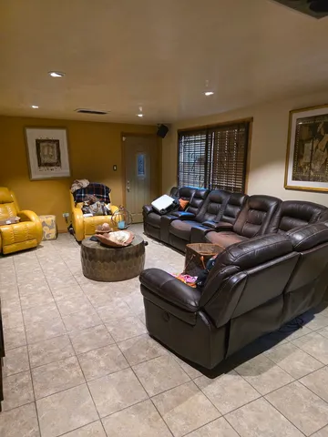 a living room with furniture and a window