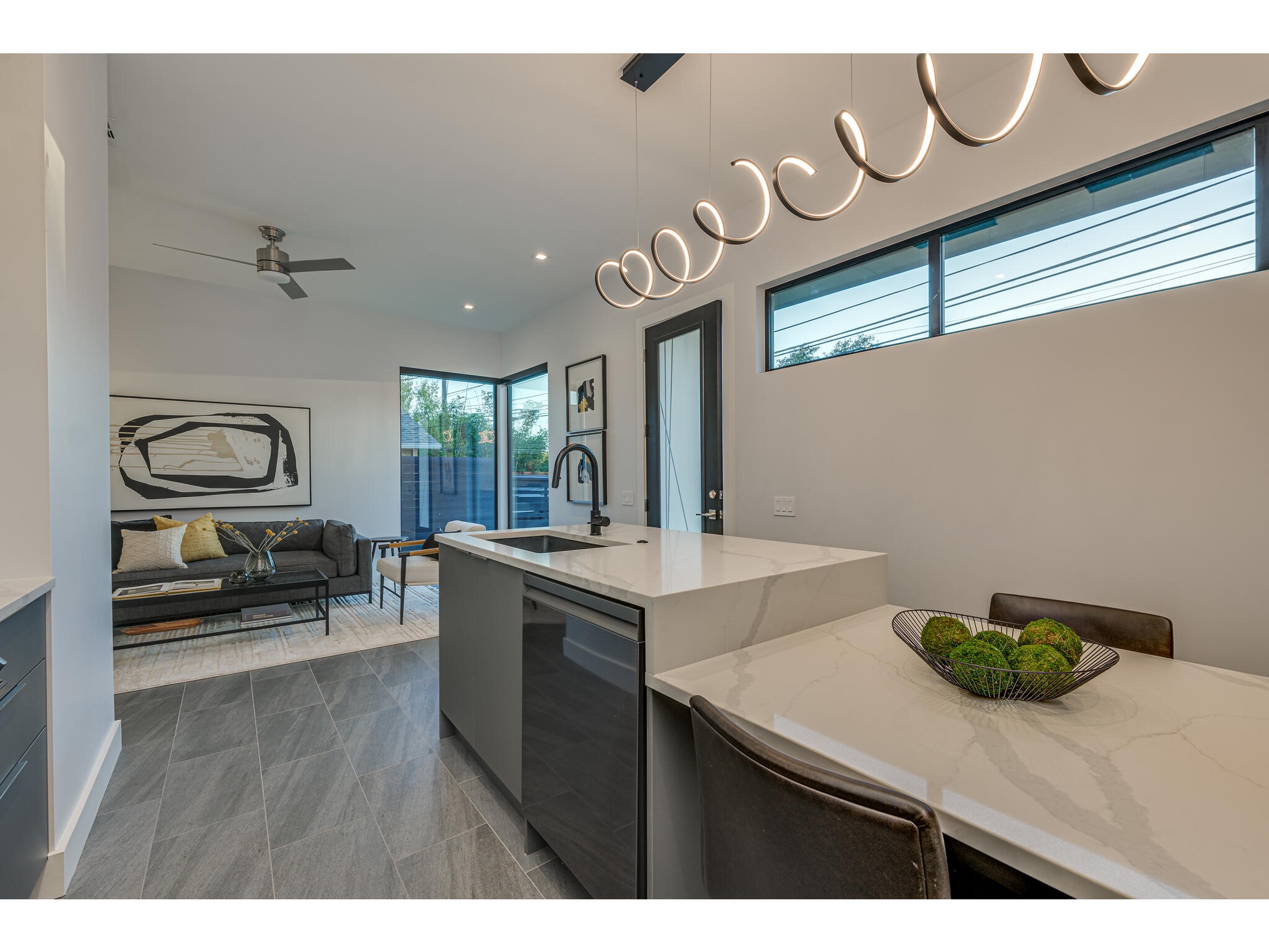 3617 Bull Creek Road Austin, TX 78731 - Photo 5 of 17 a kitchen with a sink a stove and cabinets