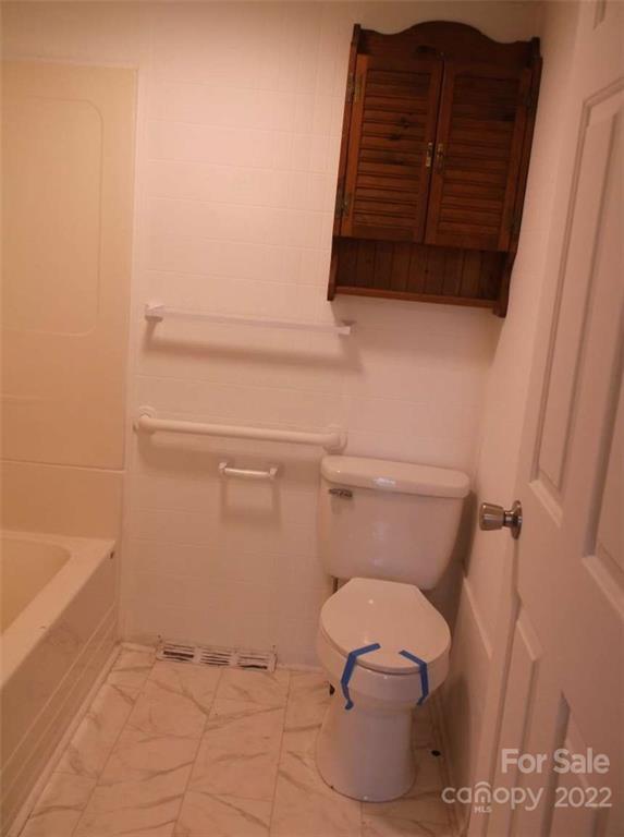 216 Whiteside Road Rutherfordton, NC 28139 - Photo 15 of 18 a bathroom with a toilet and a vanity