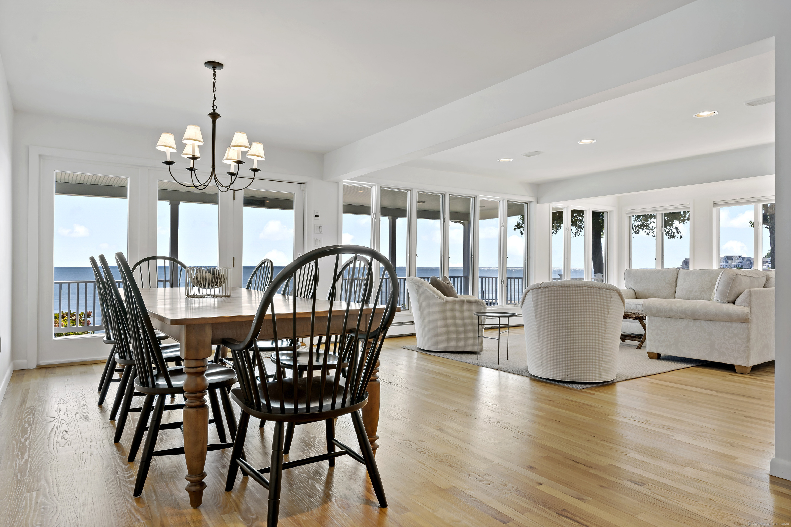 43 Shore Road Clinton, CT 06413 - Photo 13 of 32 a view of a dining room with furniture window and wooden floor