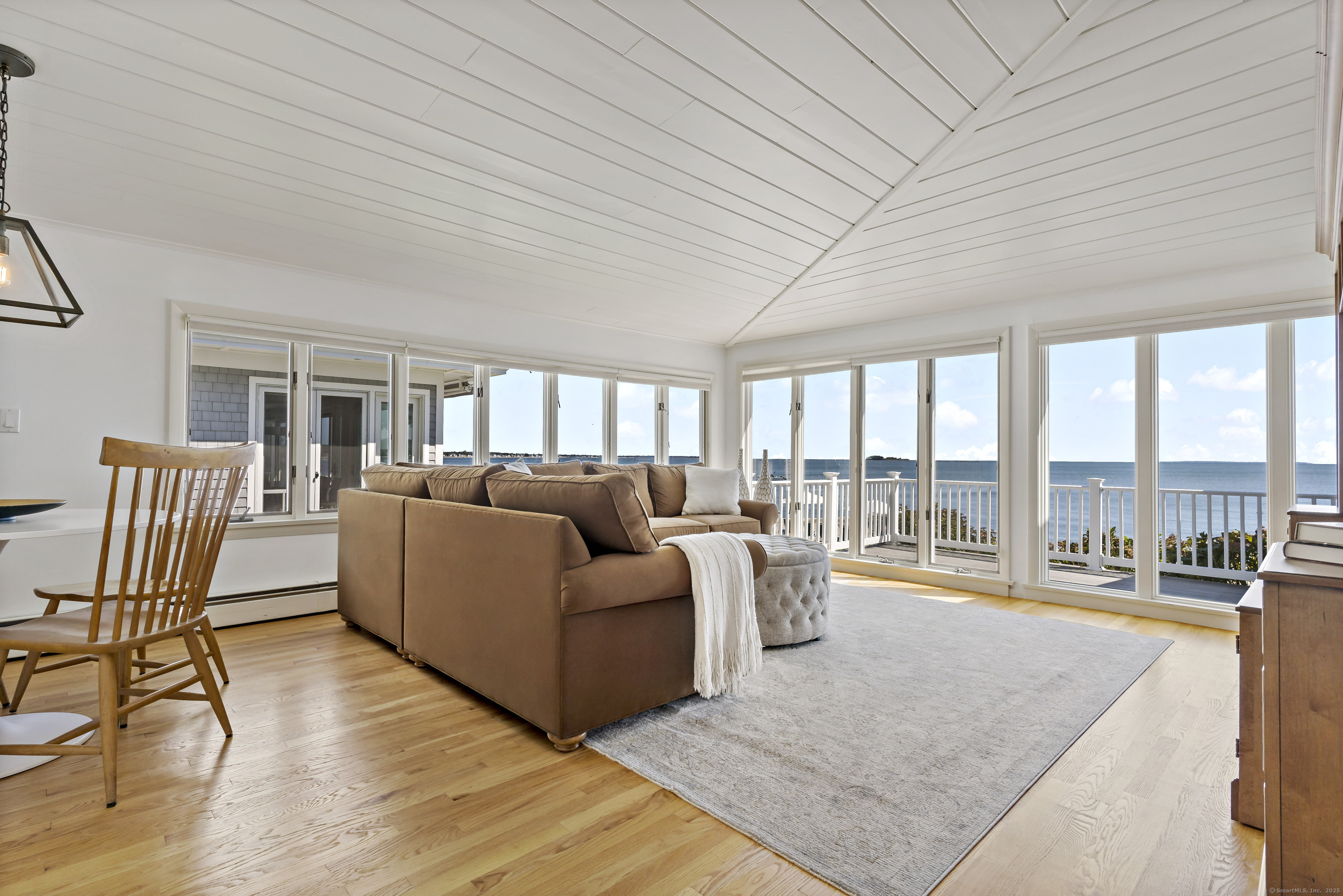 43 Shore Road Clinton, CT 06413 - Photo 15 of 32 a living room with furniture and a table