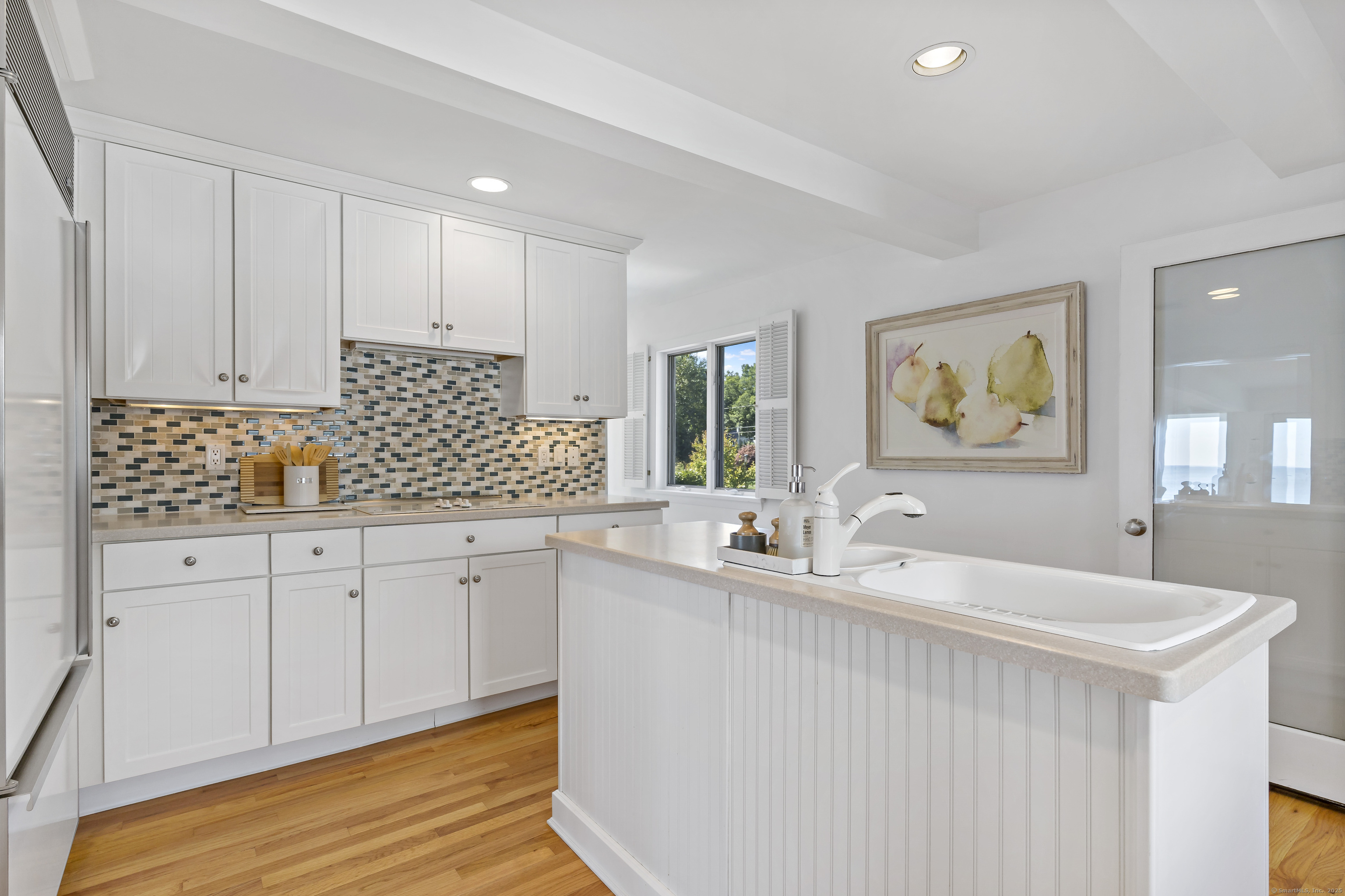 43 Shore Road Clinton, CT 06413 - Photo 18 of 32 a kitchen with granite countertop a sink and cabinets