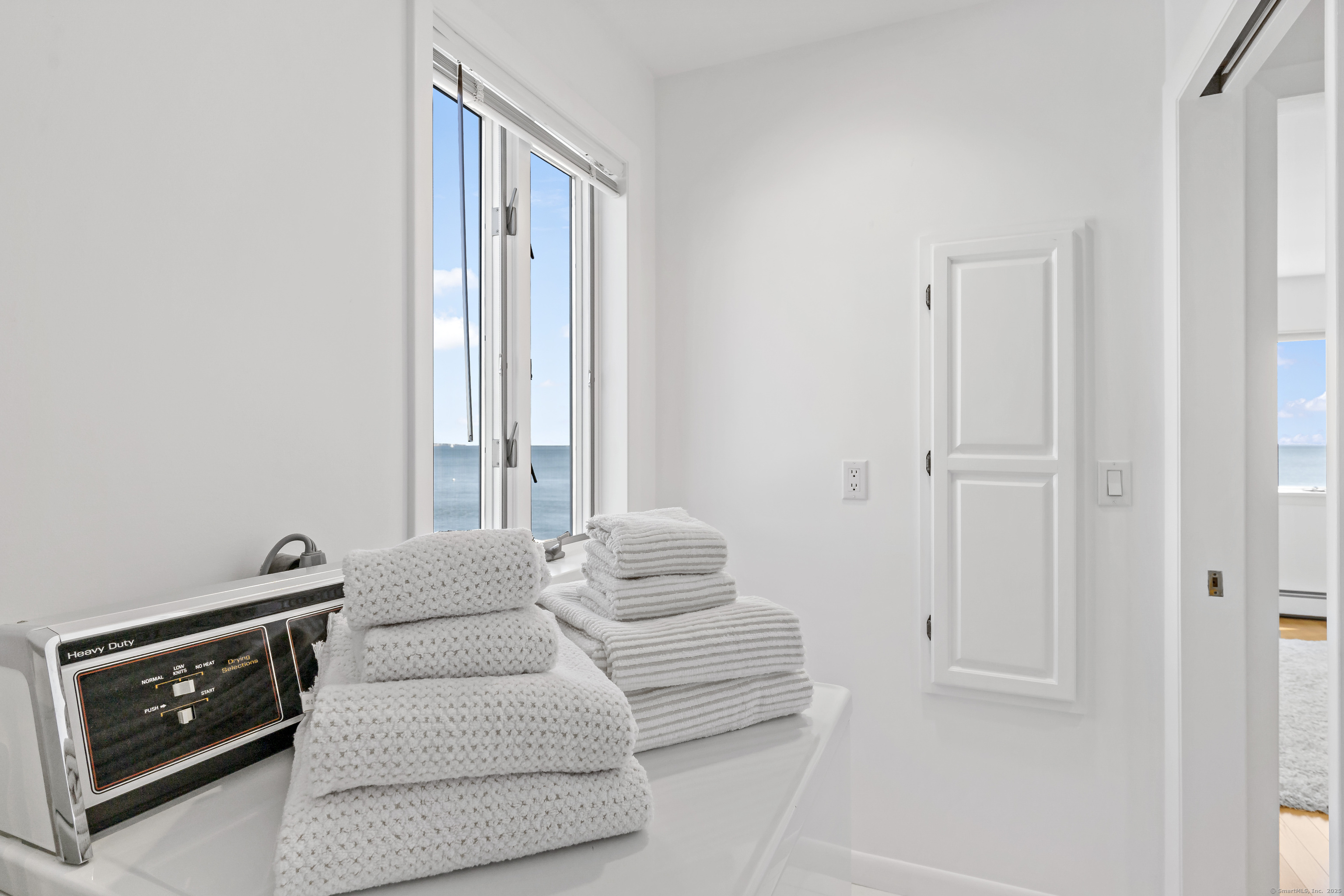 43 Shore Road Clinton, CT 06413 - Photo 21 of 32 a bedroom with a bed and a window