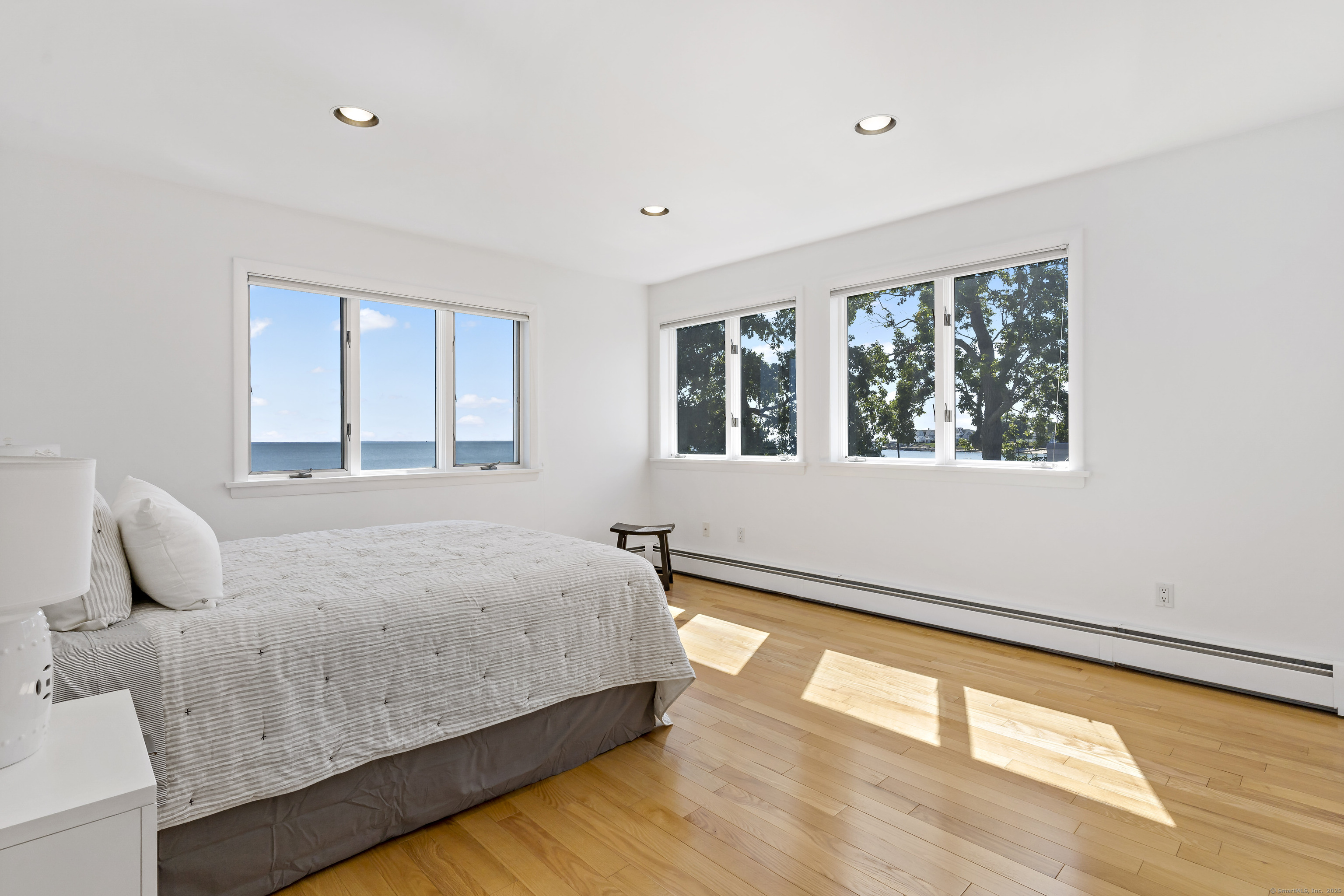 43 Shore Road Clinton, CT 06413 - Photo 22 of 32 a bedroom with a bed and window