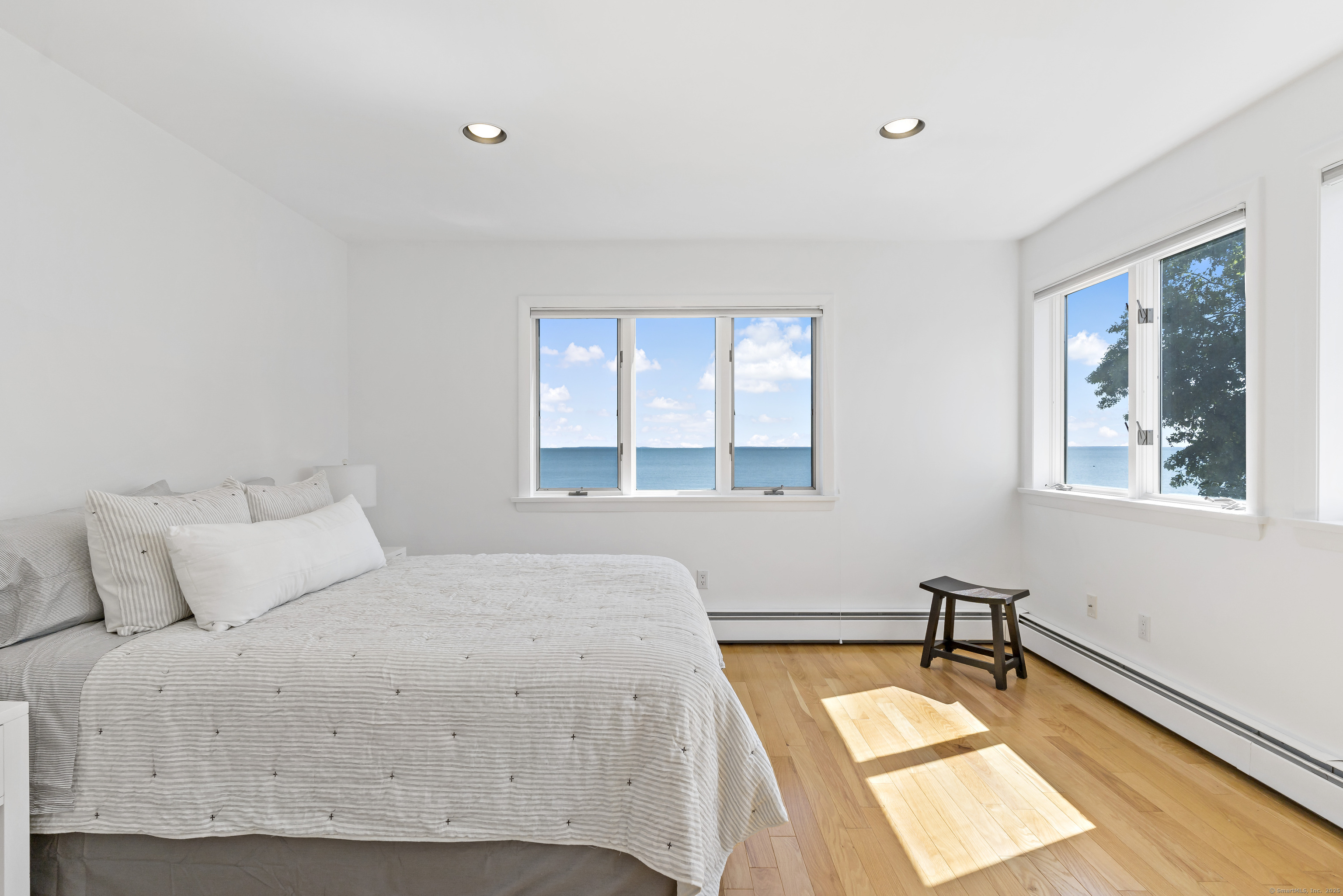 43 Shore Road Clinton, CT 06413 - Photo 23 of 32 a bedroom with a bed and a window