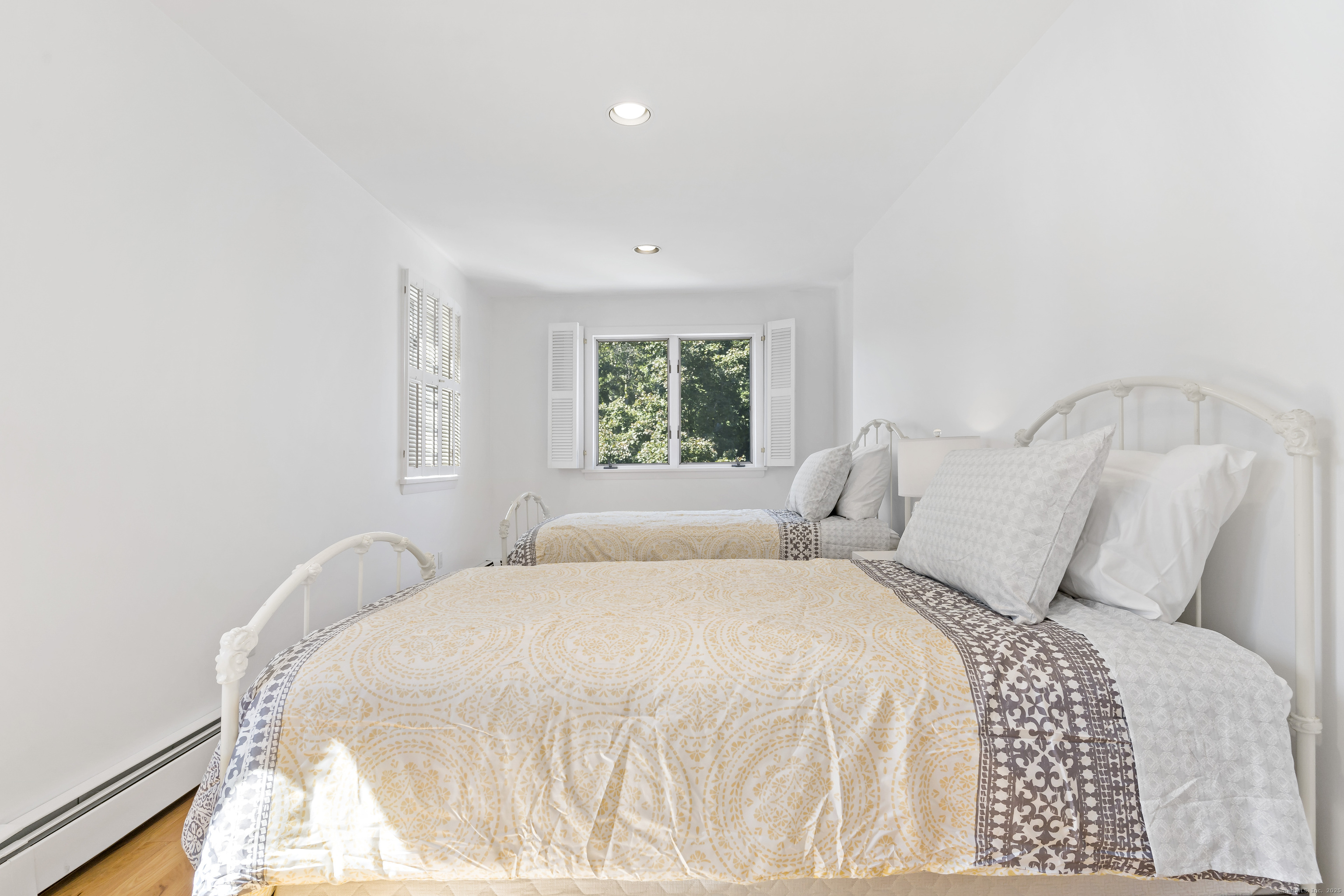 43 Shore Road Clinton, CT 06413 - Photo 24 of 32 a bedroom with a bed and a window