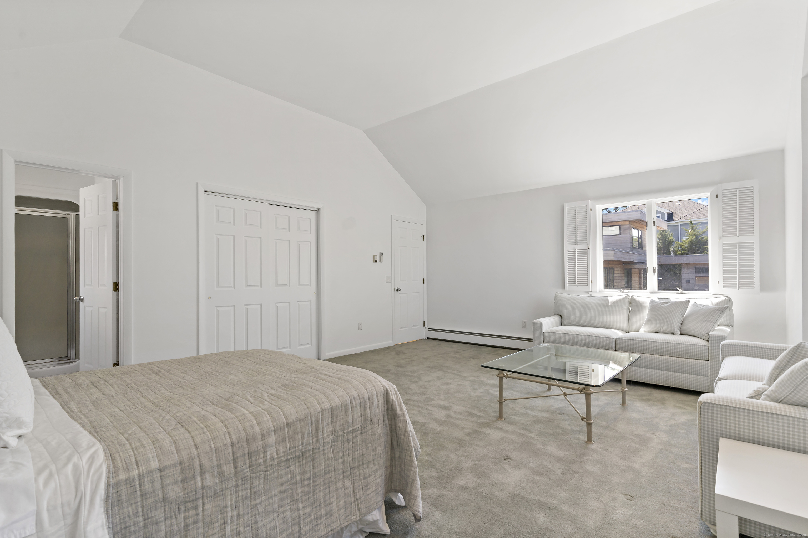 43 Shore Road Clinton, CT 06413 - Photo 26 of 32 a spacious bedroom with a bed and a couch