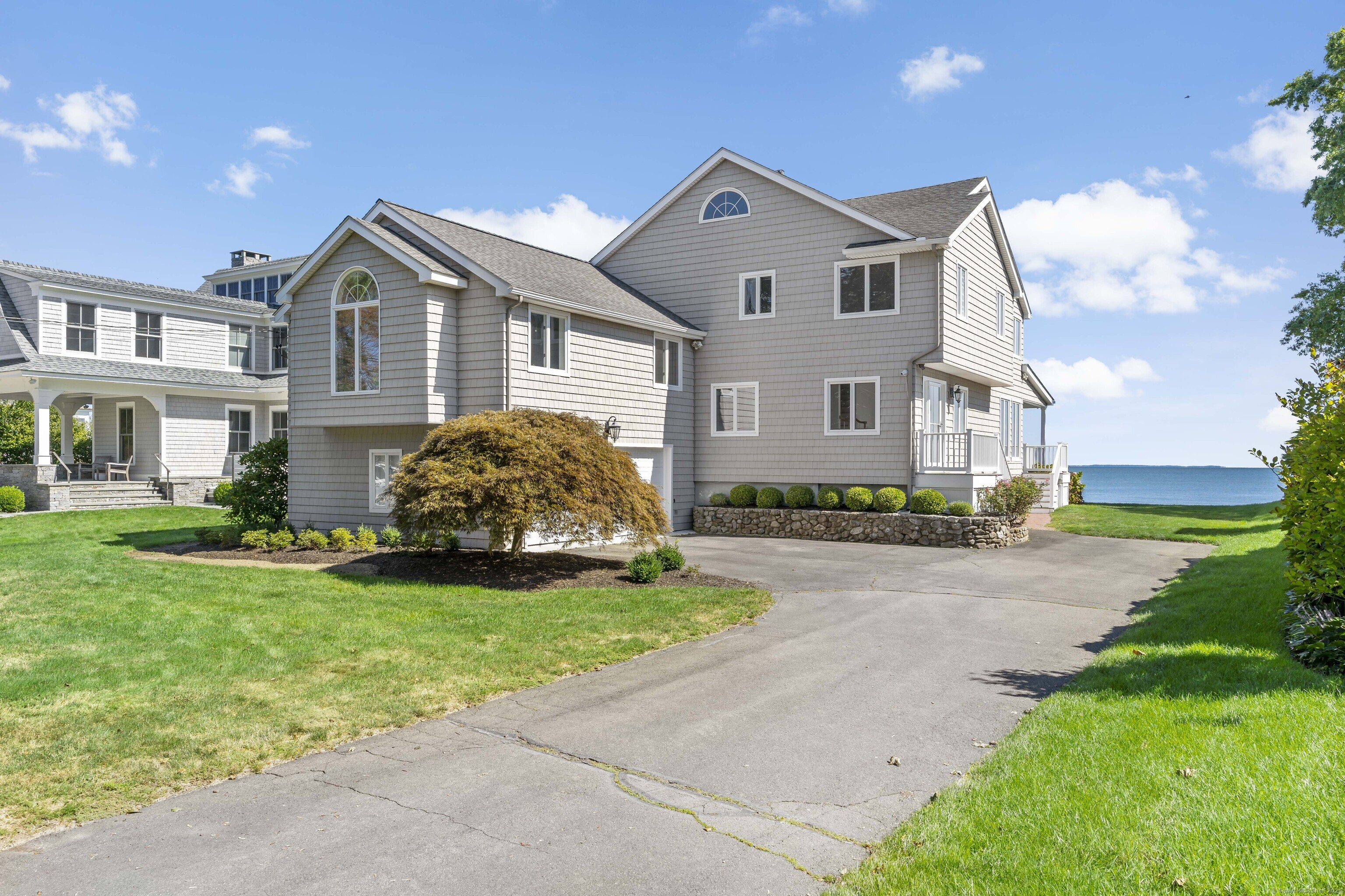 43 Shore Road Clinton, CT 06413 - Photo 28 of 32 a front view of a house with garden