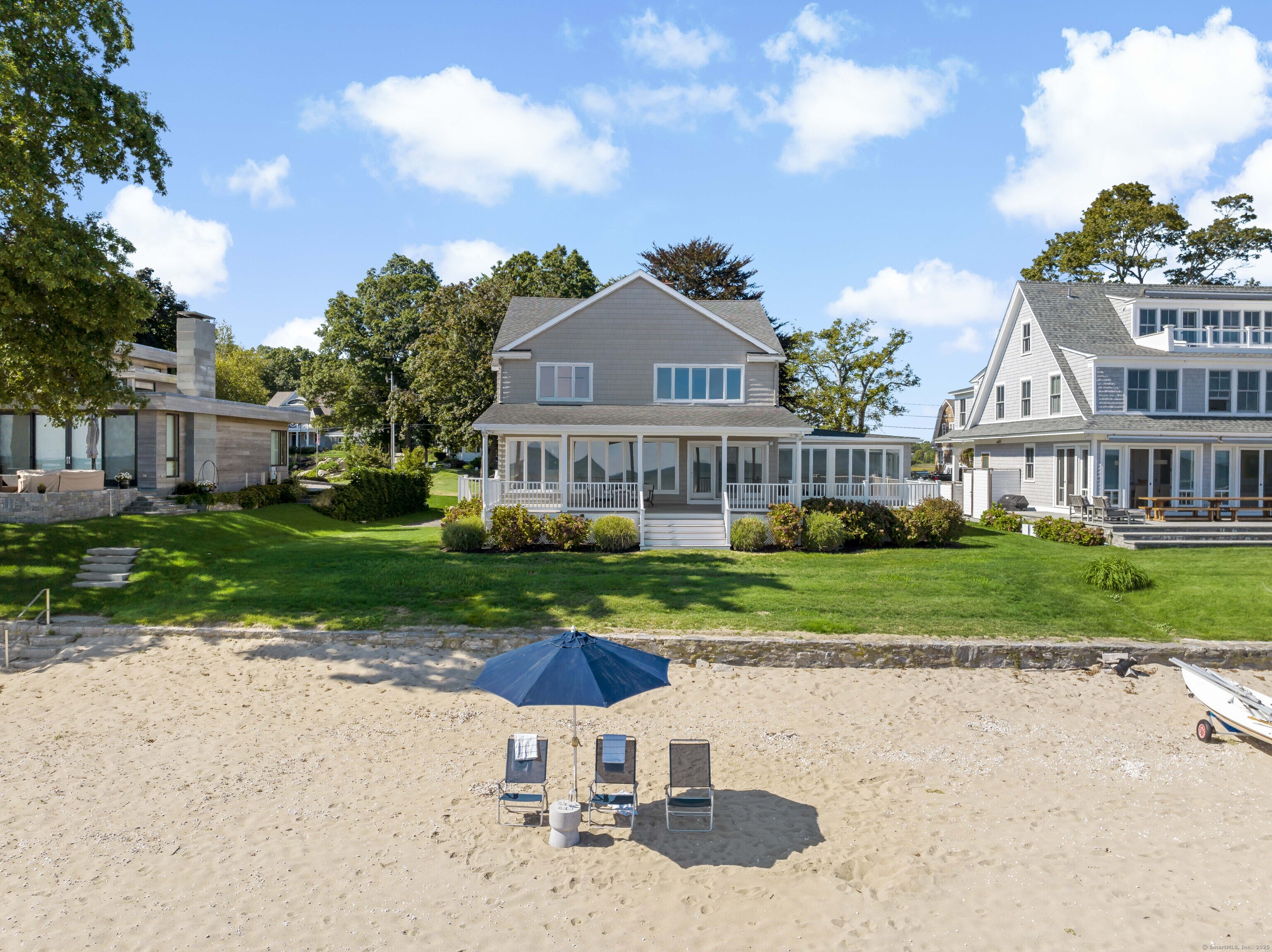 43 Shore Road Clinton, CT 06413 - Photo 6 of 32 a front view of a house with garden