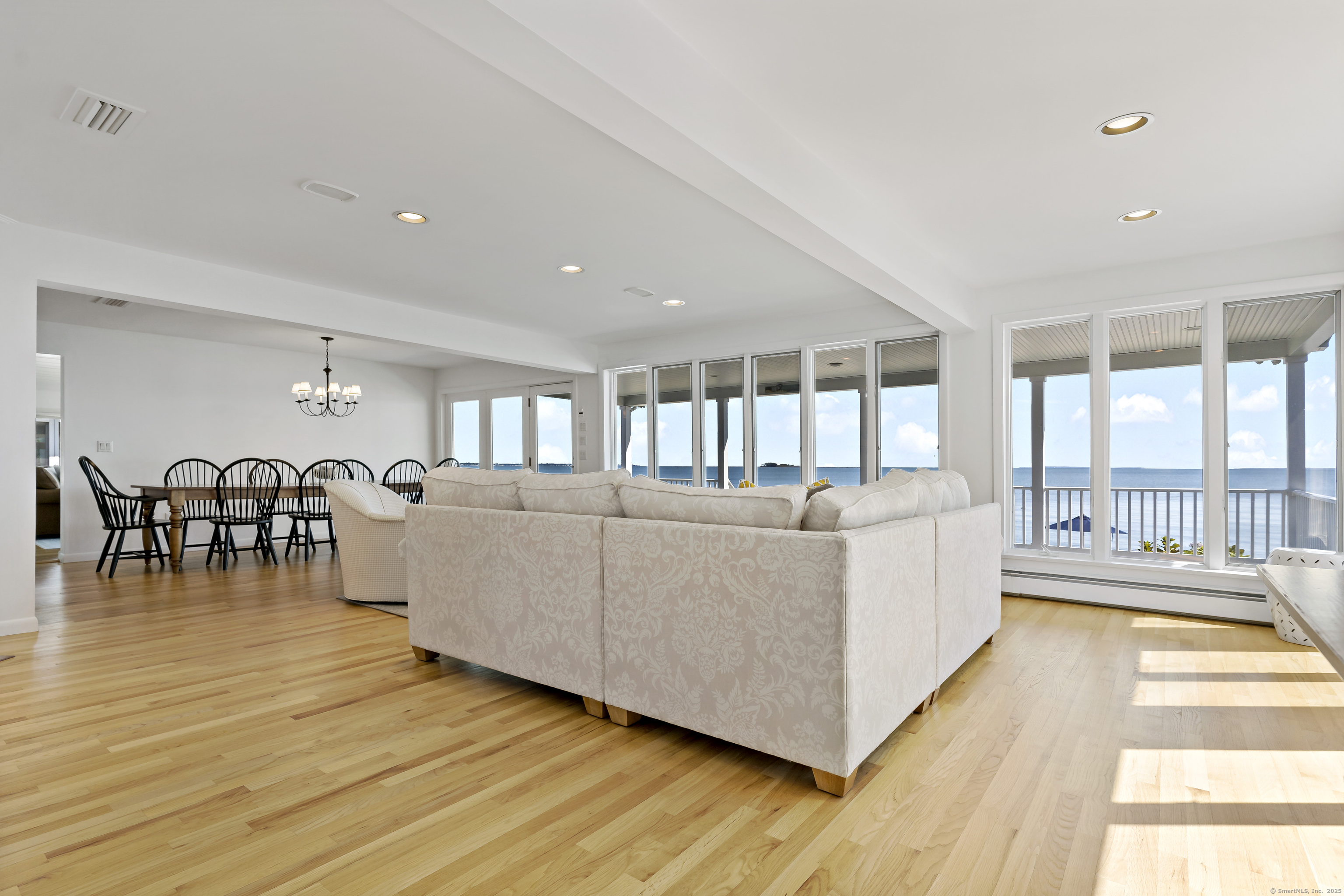 43 Shore Road Clinton, CT 06413 - Photo 10 of 32 a living room with furniture and a table
