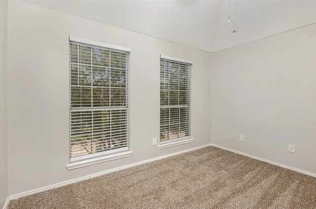 a view of empty room with windows