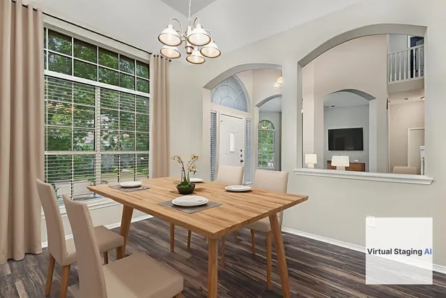 a view of a dining room with furniture window and outside view