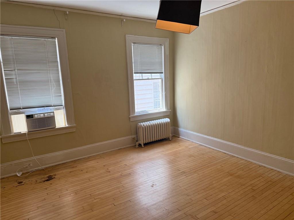 846 Briarcliff Road Northeast Atlanta, GA 30306 - Photo 11 of 22 an empty room with wooden floor and windows