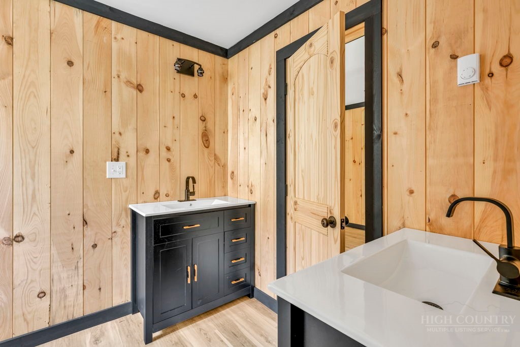 209 Meadow Loop Newland, NC 28657 - Photo 20 of 30 a bathroom with a sink and a mirror