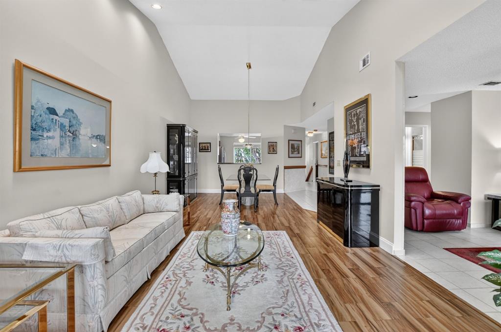 7873 La Mirada Drive, Unit 7873 Boca Raton, FL 33433 - Photo 12 of 40 a living room with furniture or couch and a view of kitchen