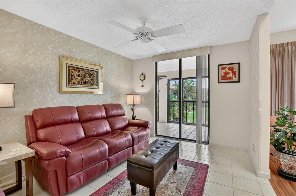 7873 La Mirada Drive, Unit 7873 Boca Raton, FL 33433 - Photo 16 of 40 a living room with furniture and a large window