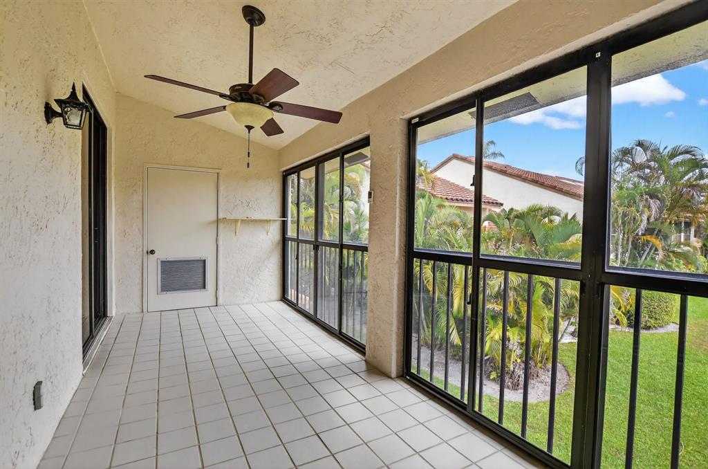 7873 La Mirada Drive, Unit 7873 Boca Raton, FL 33433 - Photo 27 of 40 a view of empty room with wooden floor and fan