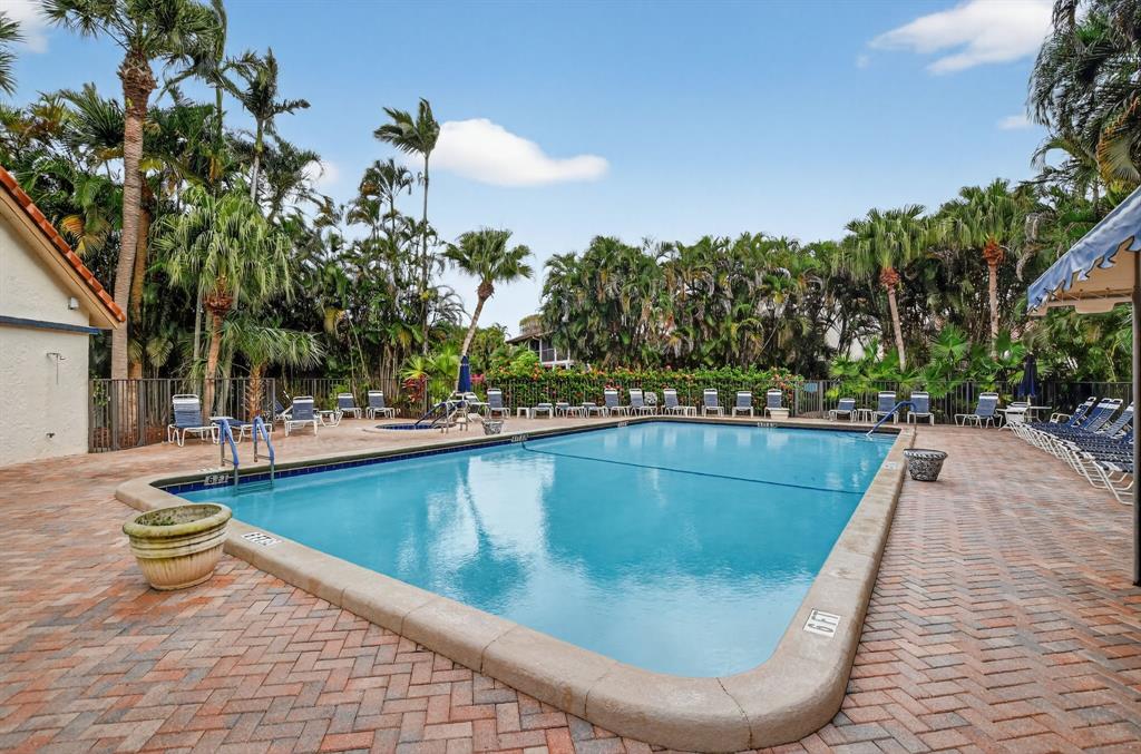 7873 La Mirada Drive, Unit 7873 Boca Raton, FL 33433 - Photo 39 of 40 a view of swimming pool with outdoor seating and plants