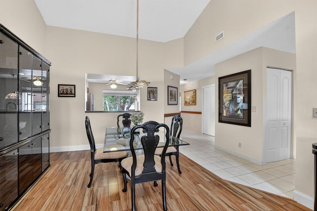 7873 La Mirada Drive, Unit 7873 Boca Raton, FL 33433 - Photo 10 of 40 a view of a dining room with furniture window and wooden floor