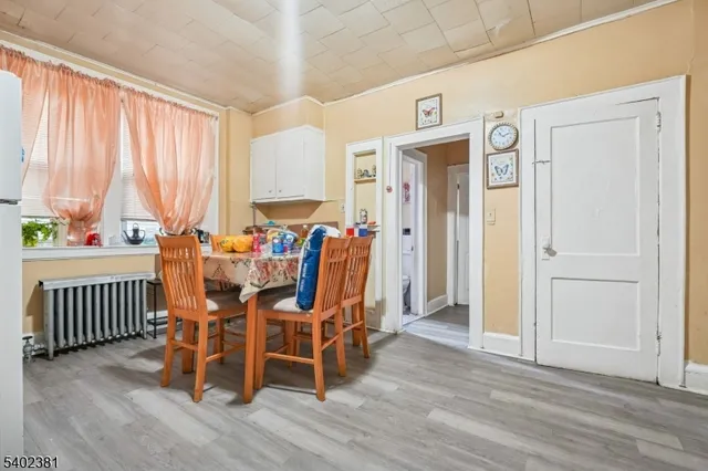 a view of a dining room with furniture and window