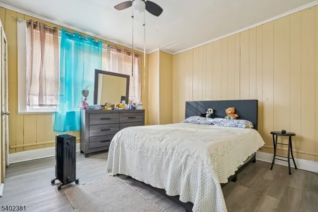 a bedroom with bed and window