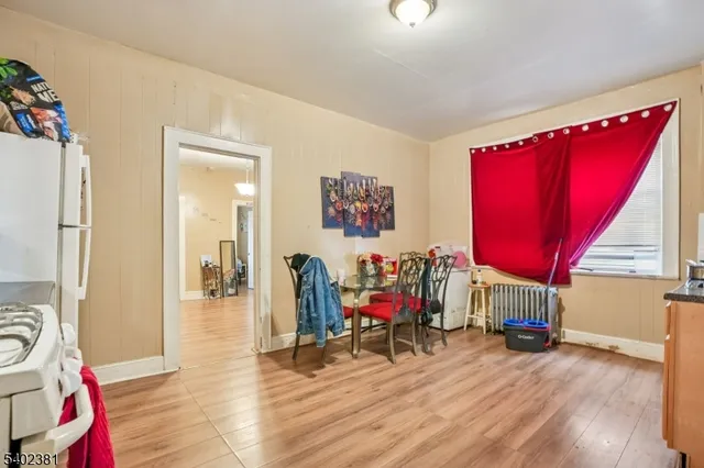 a living room with furniture a rug and a table