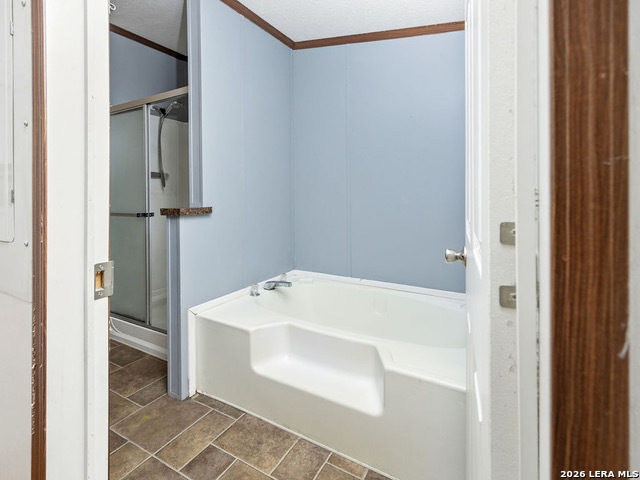 135 Savannah Ridge Von Ormy, TX 78073 - Photo 23 of 45 a bathroom with a bathtub