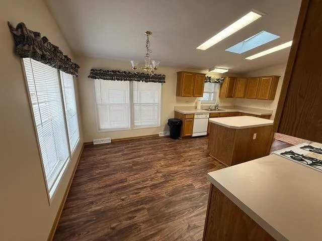 a room with wooden floor and glass door
