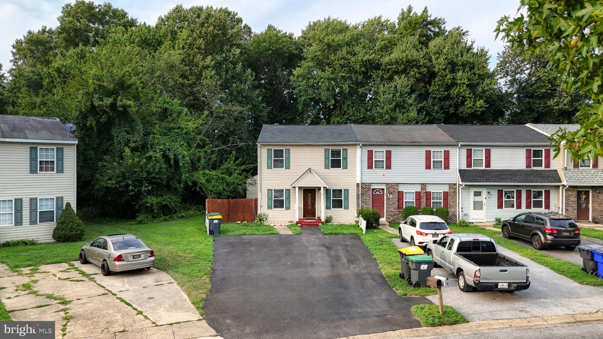 13 Teal Circle Newark, DE 19702 - Photo 23 of 29 a front view of a house with garden and sitting area
