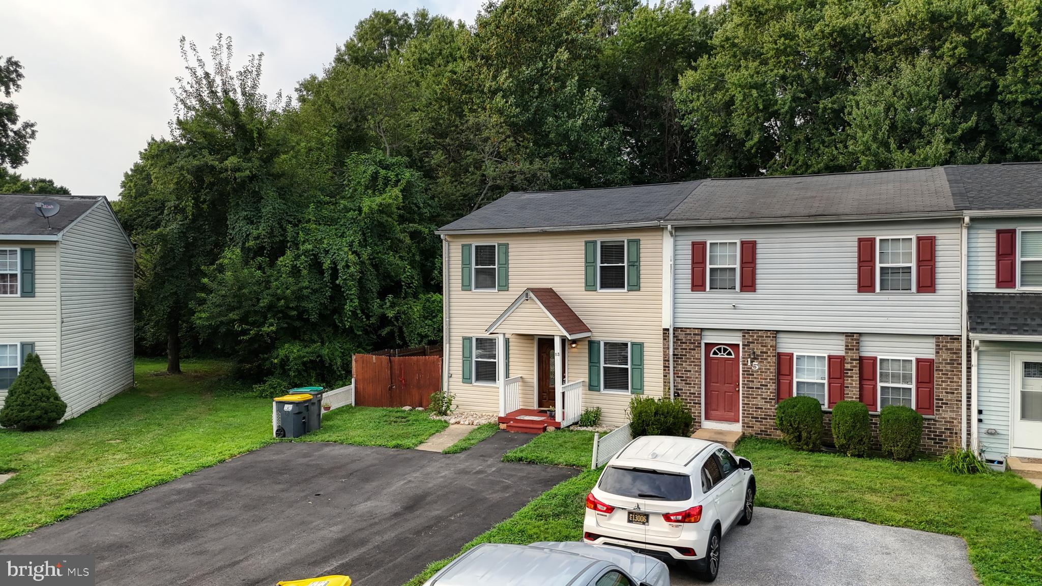 13 Teal Circle Newark, DE 19702 - Photo 25 of 29 a car parked in front of a house and a yard