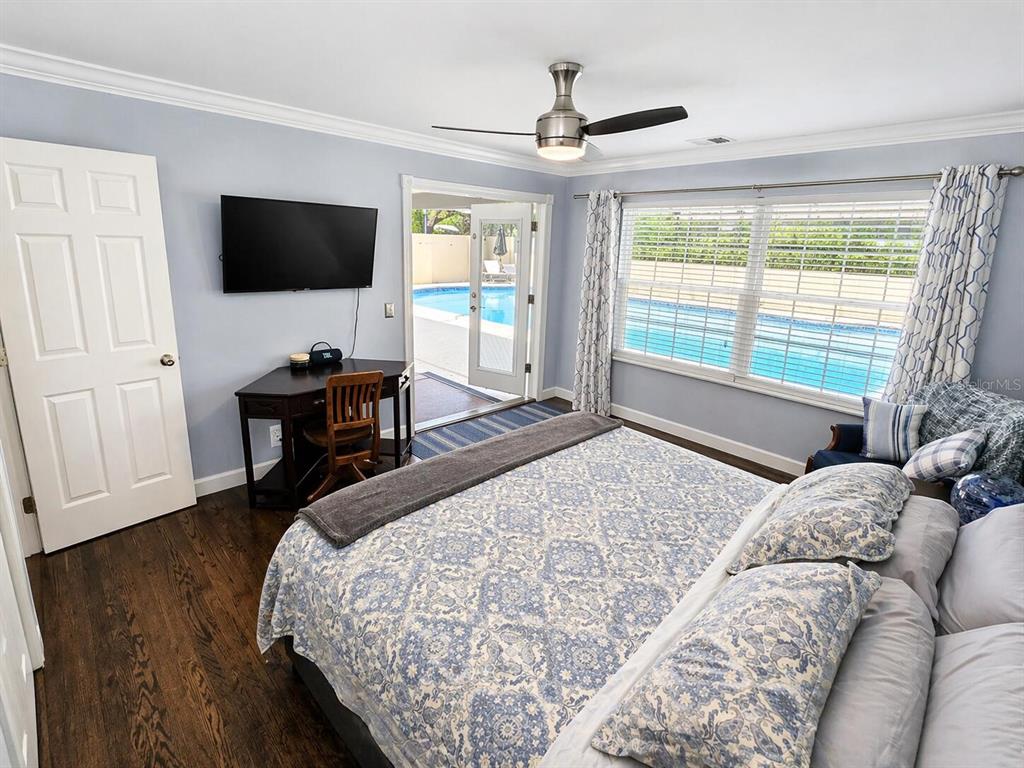 2313 Southeast 7th Street Ocala, FL 34471 - Photo 12 of 54 a bedroom with a bed window tv and a window
