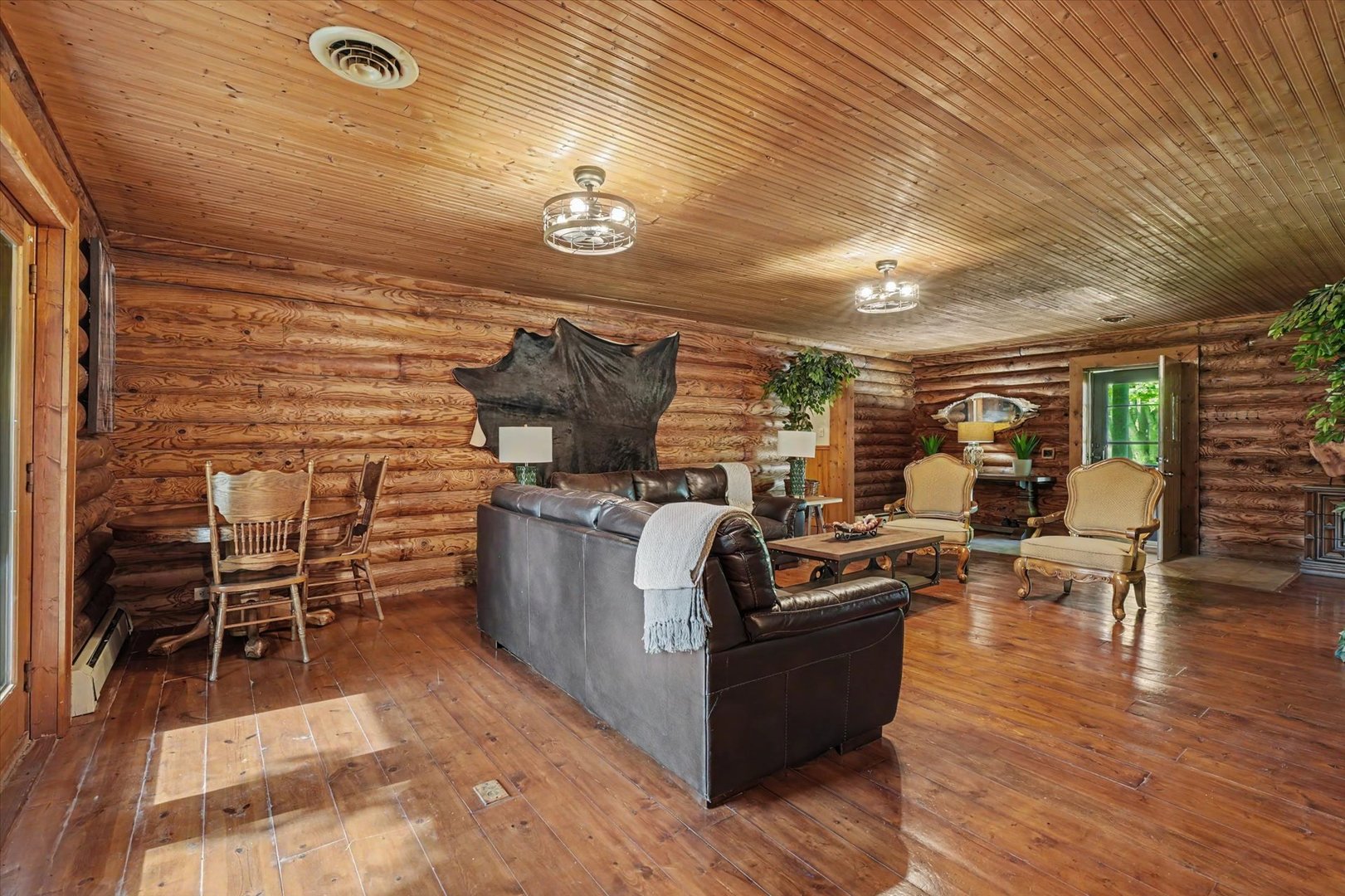 2431 North 1450 East Road Mansfield, IL 61854 - Photo 12 of 78 a view of a dining room with furniture window and wooden floor