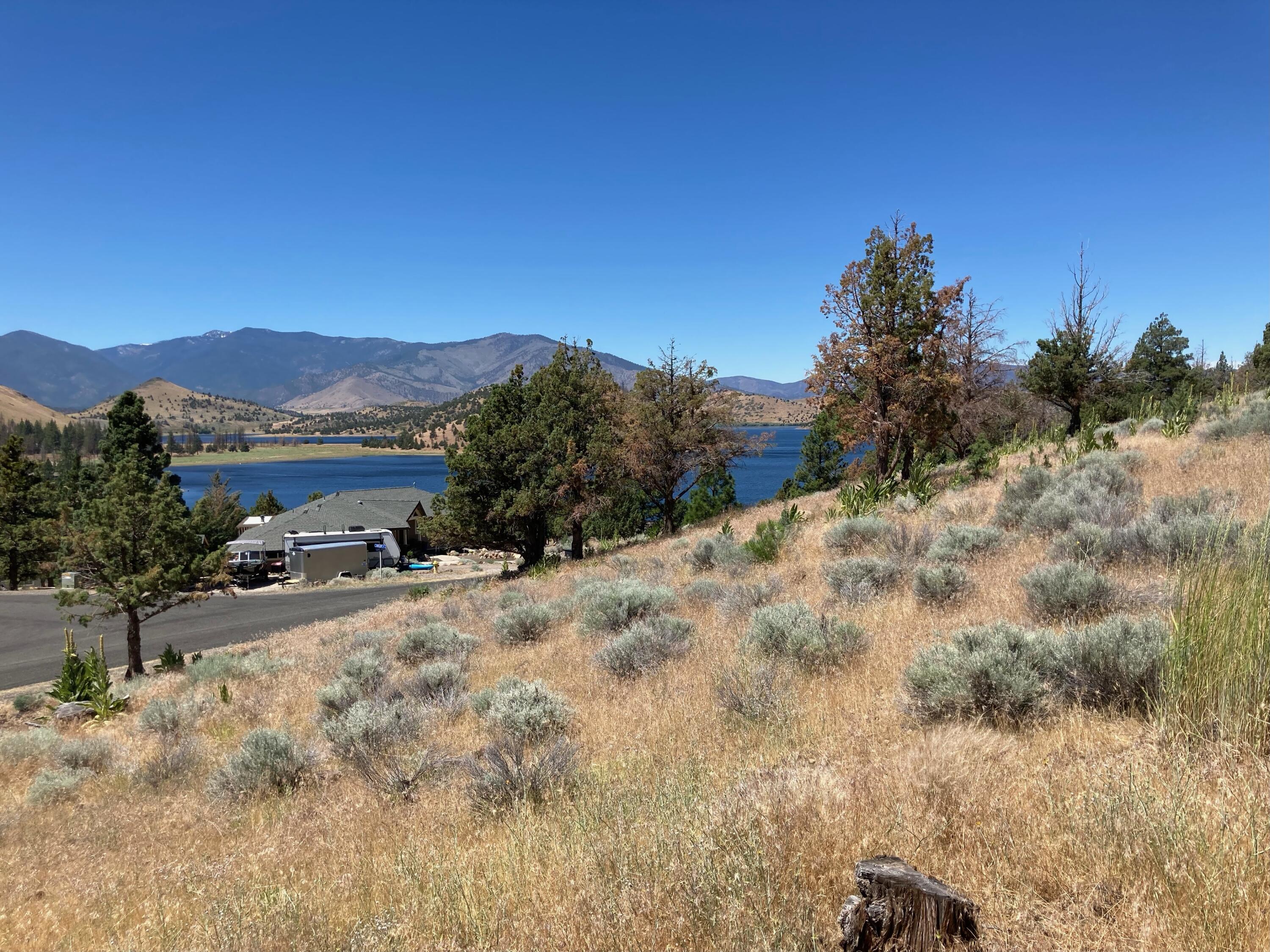 0 Saddle Ridge Road Weed, CA 96094 - Photo 4 of 9 a view of a dry yard with mountains in the background