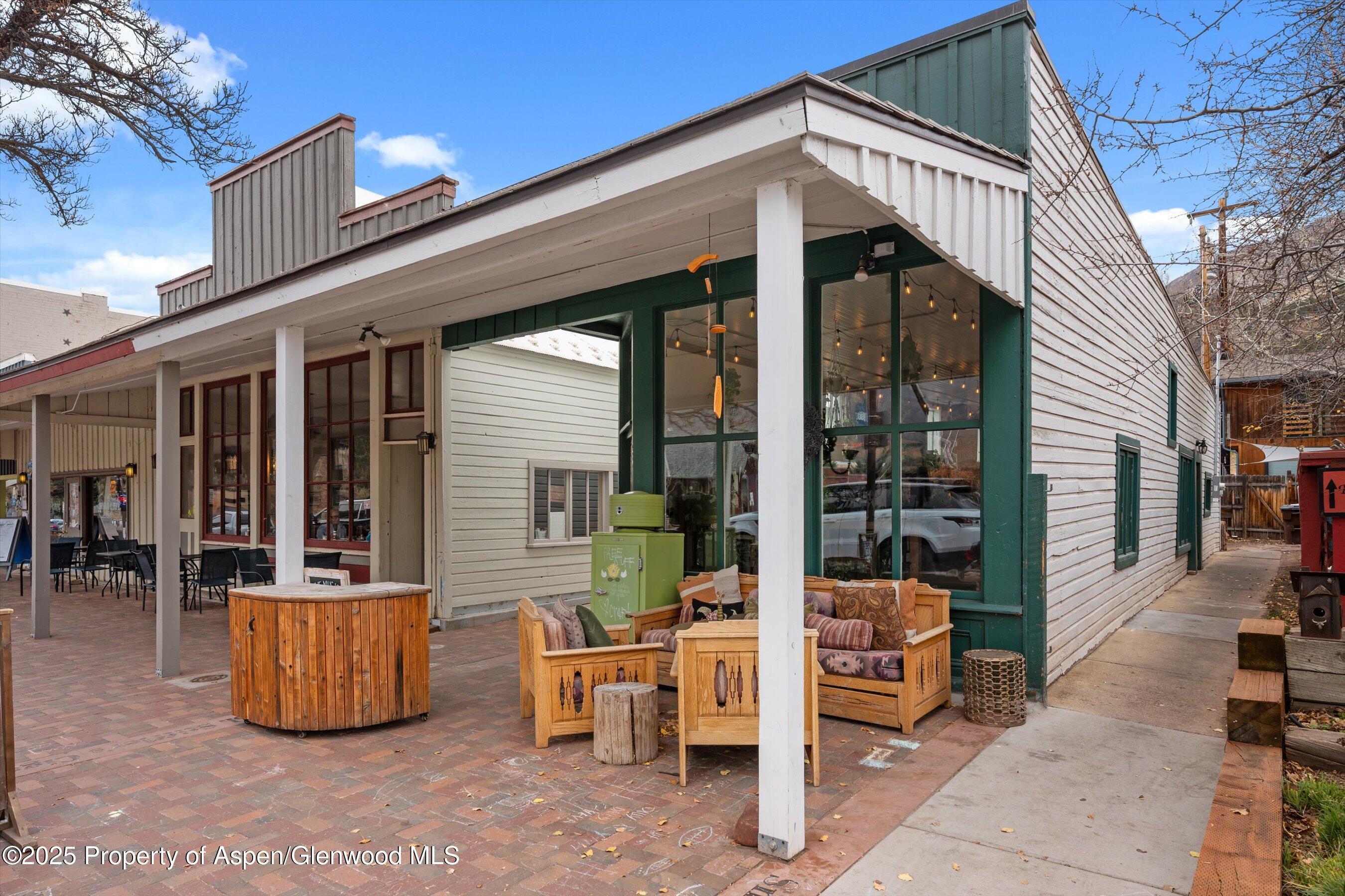 160 Midland Avenue Basalt, CO 81621 - Photo 2 of 13 a view of living room with barbeque grill and wooden fence