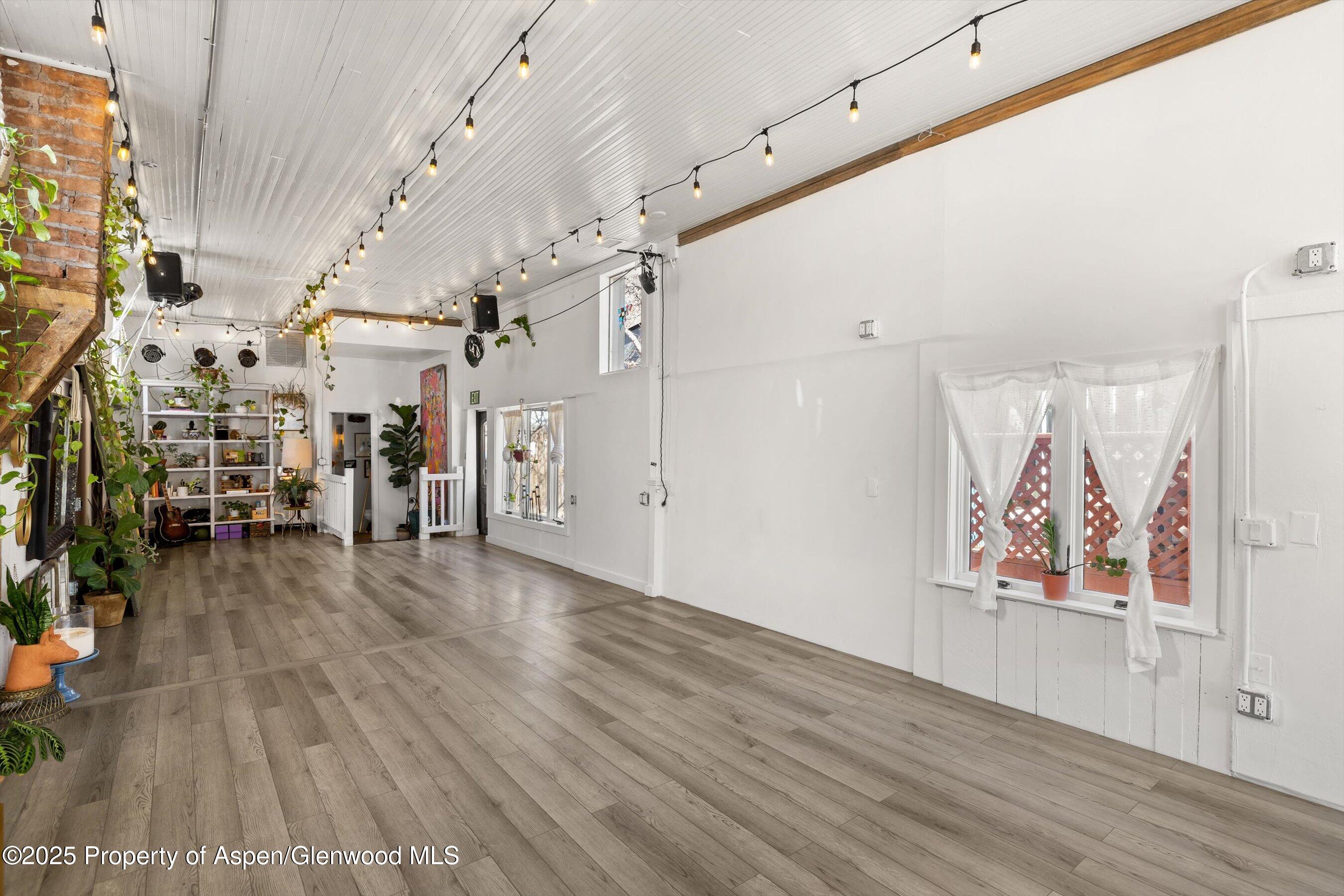 160 Midland Avenue Basalt, CO 81621 - Photo 6 of 13 a view of a hallway with wooden floor