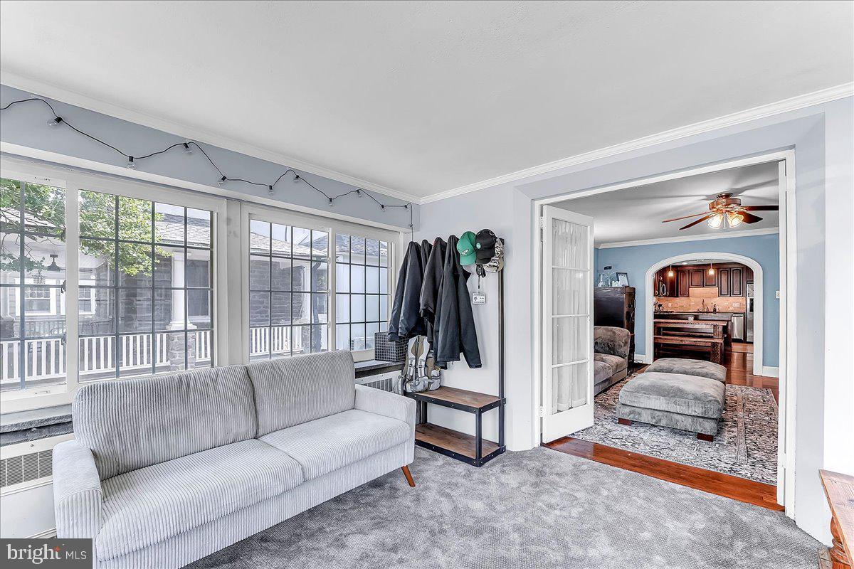 247 Sagamore Road Havertown, PA 19083 - Photo 16 of 41 a living room with furniture and a floor to ceiling window