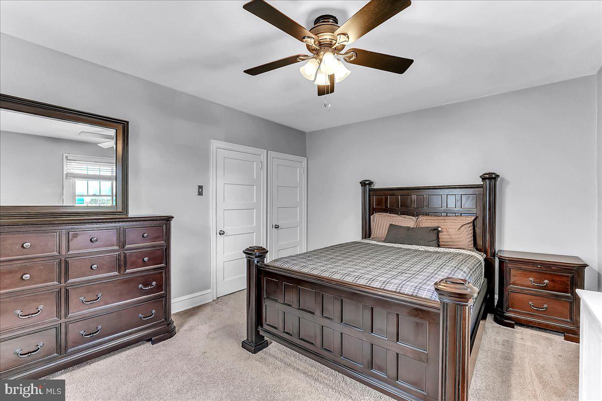 247 Sagamore Road Havertown, PA 19083 - Photo 18 of 41 a bedroom with a bed and a chandelier