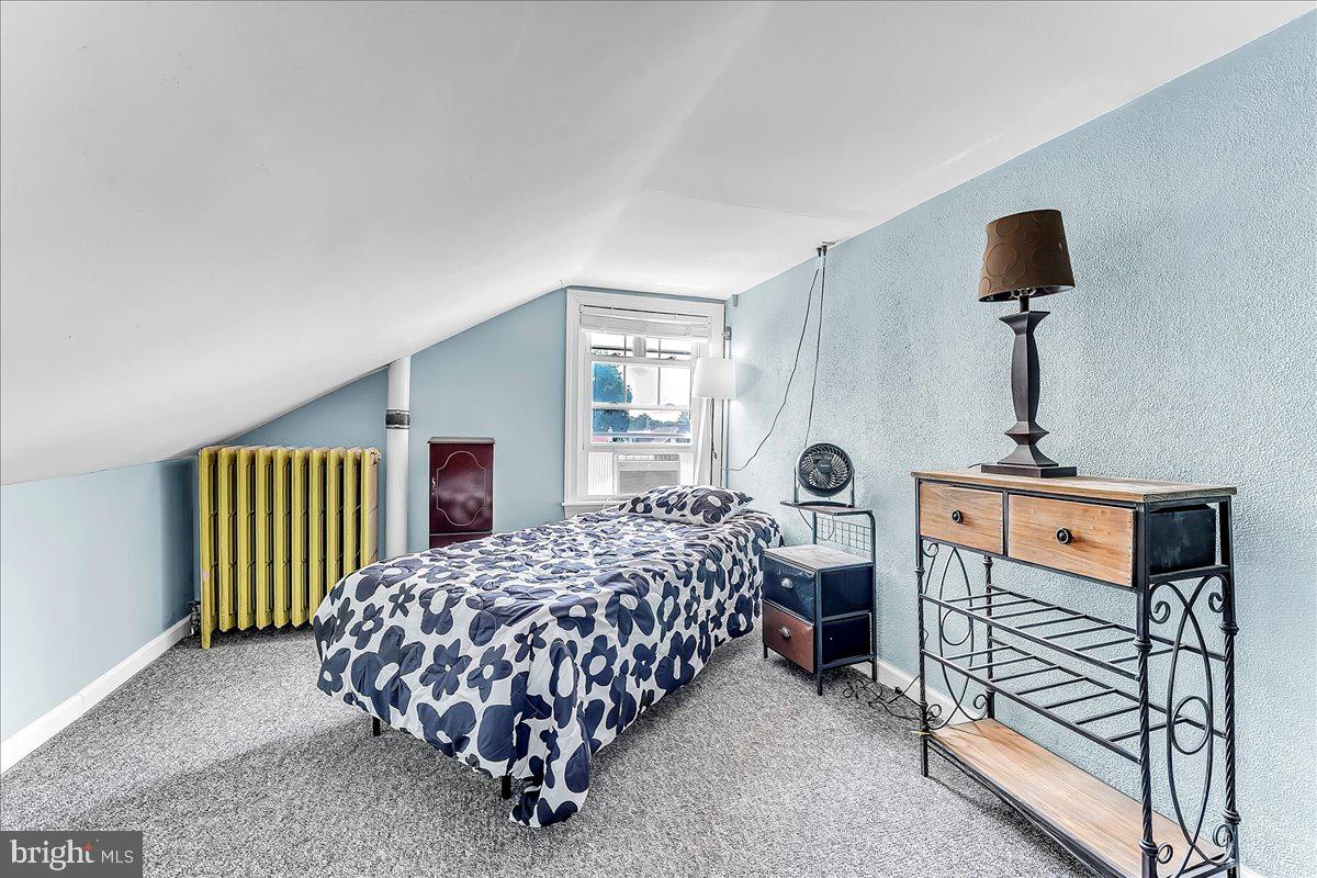 247 Sagamore Road Havertown, PA 19083 - Photo 21 of 41 a bedroom with a bed and a chandelier