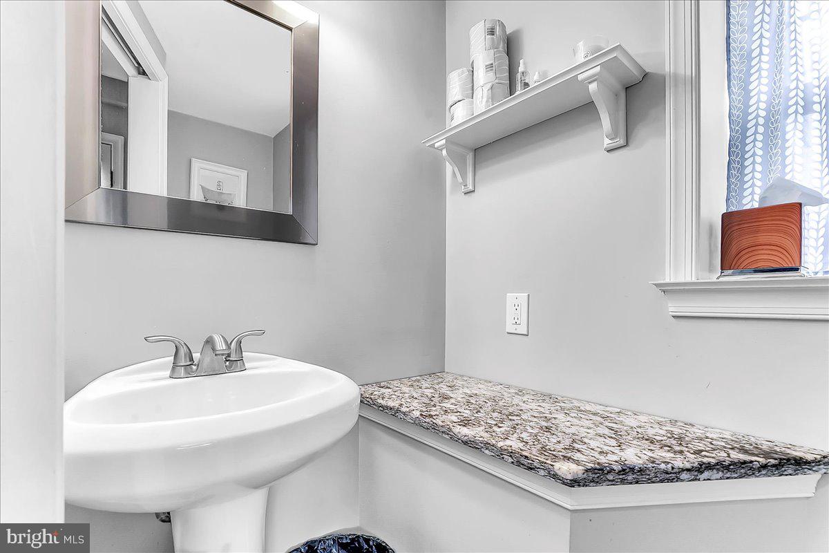 247 Sagamore Road Havertown, PA 19083 - Photo 23 of 41 a bathroom with a sink and mirror