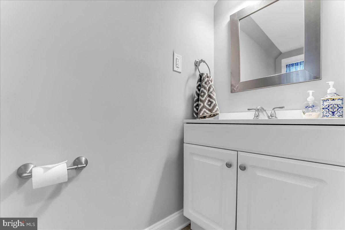 247 Sagamore Road Havertown, PA 19083 - Photo 24 of 41 a bathroom with a sink and a mirror