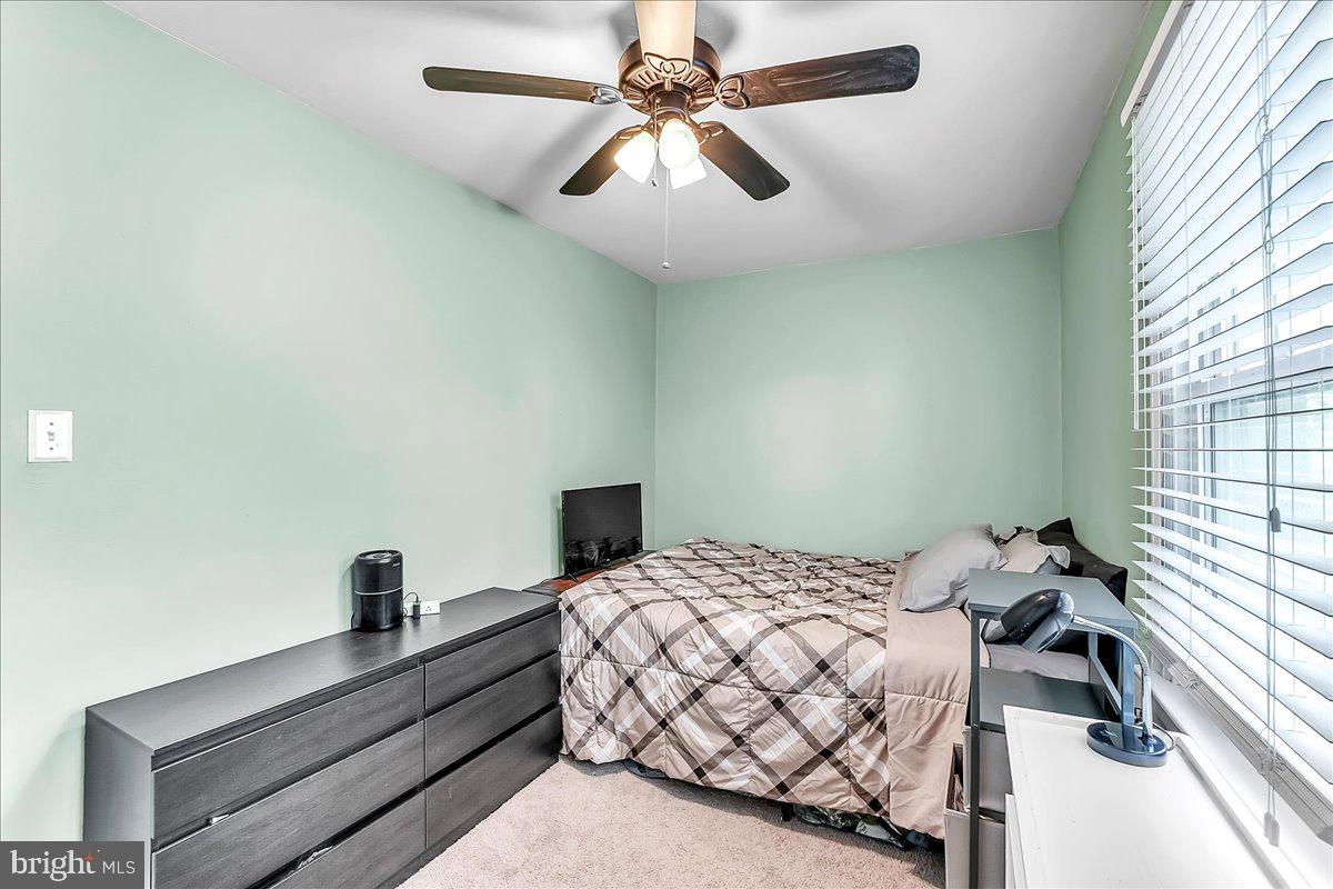 247 Sagamore Road Havertown, PA 19083 - Photo 26 of 41 a bedroom with a bed and a chandelier