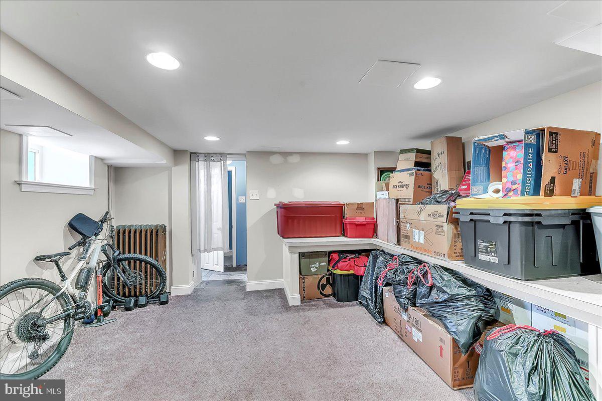 247 Sagamore Road Havertown, PA 19083 - Photo 32 of 41 a living room with furniture a flat screen tv and a large window