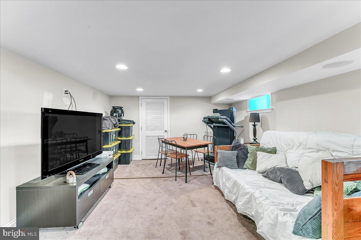 247 Sagamore Road Havertown, PA 19083 - Photo 33 of 41 a living room with furniture and a flat screen tv