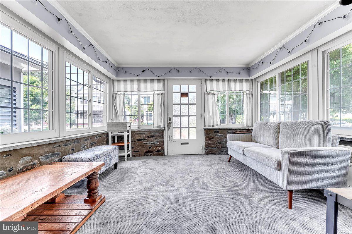 247 Sagamore Road Havertown, PA 19083 - Photo 5 of 41 a living room with furniture and large windows