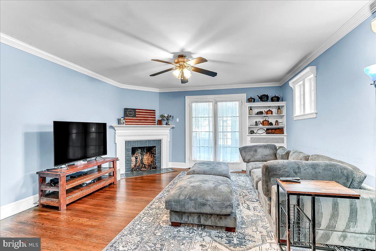 247 Sagamore Road Havertown, PA 19083 - Photo 7 of 41 a living room with furniture fireplace and flat screen tv
