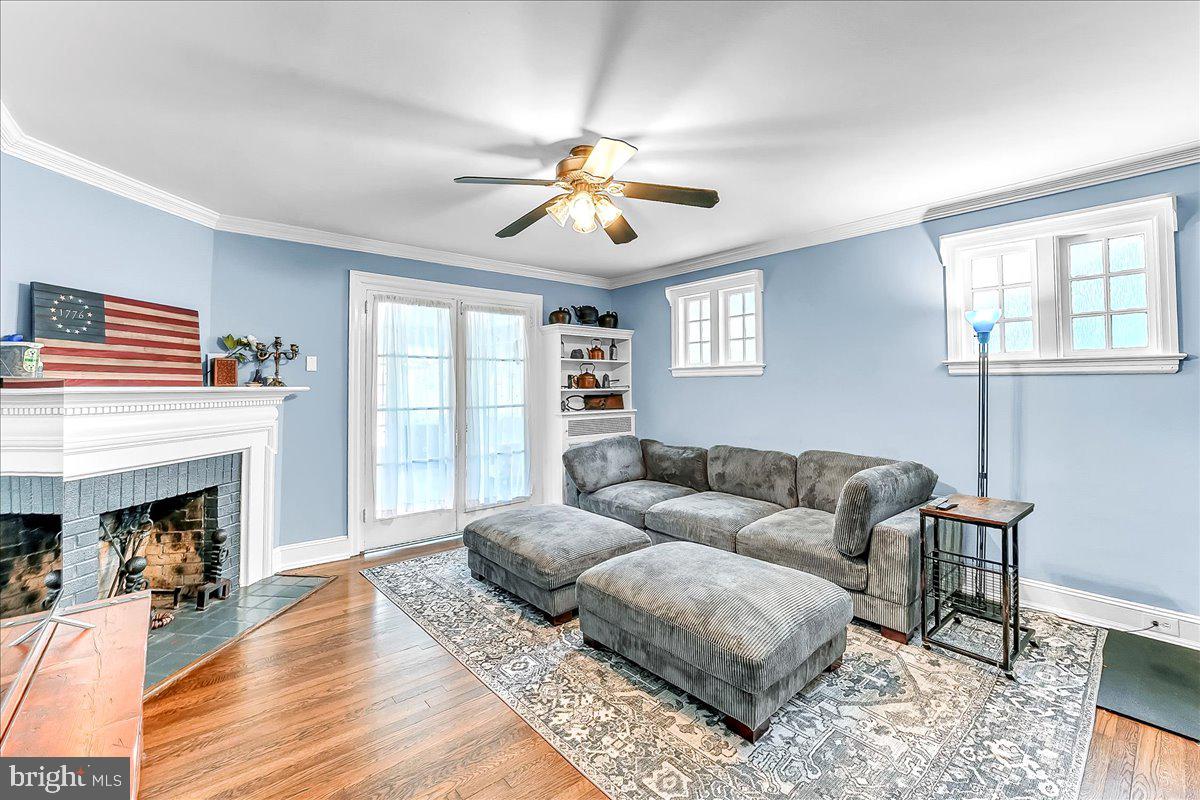 247 Sagamore Road Havertown, PA 19083 - Photo 10 of 41 a living room with furniture a fireplace and wooden floor