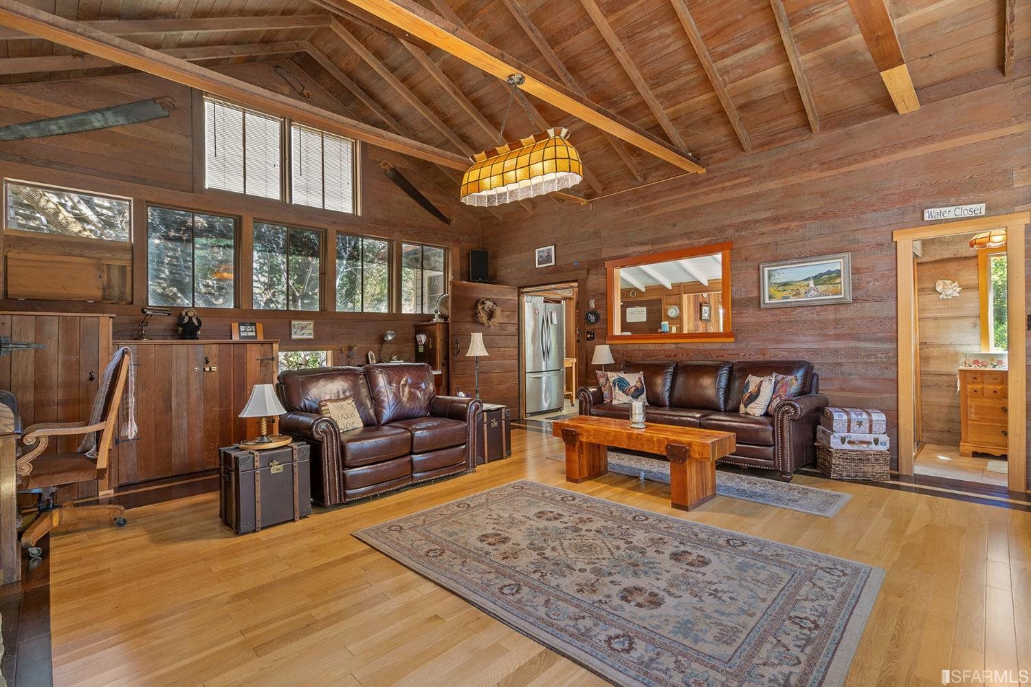 201 Castle Hill Ranch Road Walnut Creek, CA 94595 - Photo 12 of 44 a living room with furniture and a chandelier
