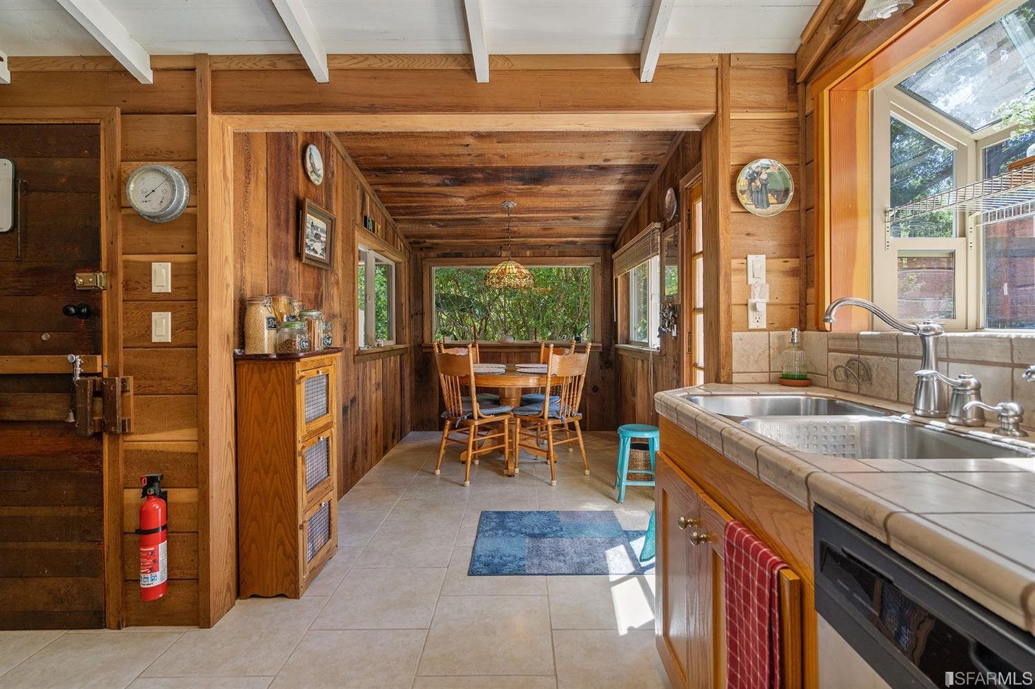 201 Castle Hill Ranch Road Walnut Creek, CA 94595 - Photo 20 of 44 a dining room with furniture and a large window